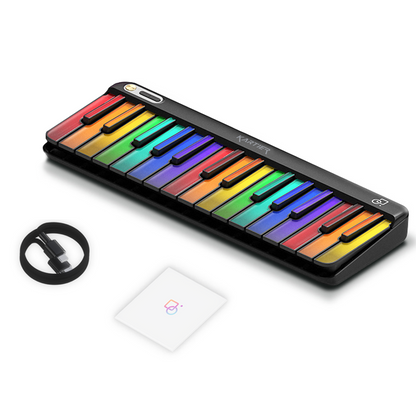 Colorful Kartier piano portable keyboard with USB cable on a white background
